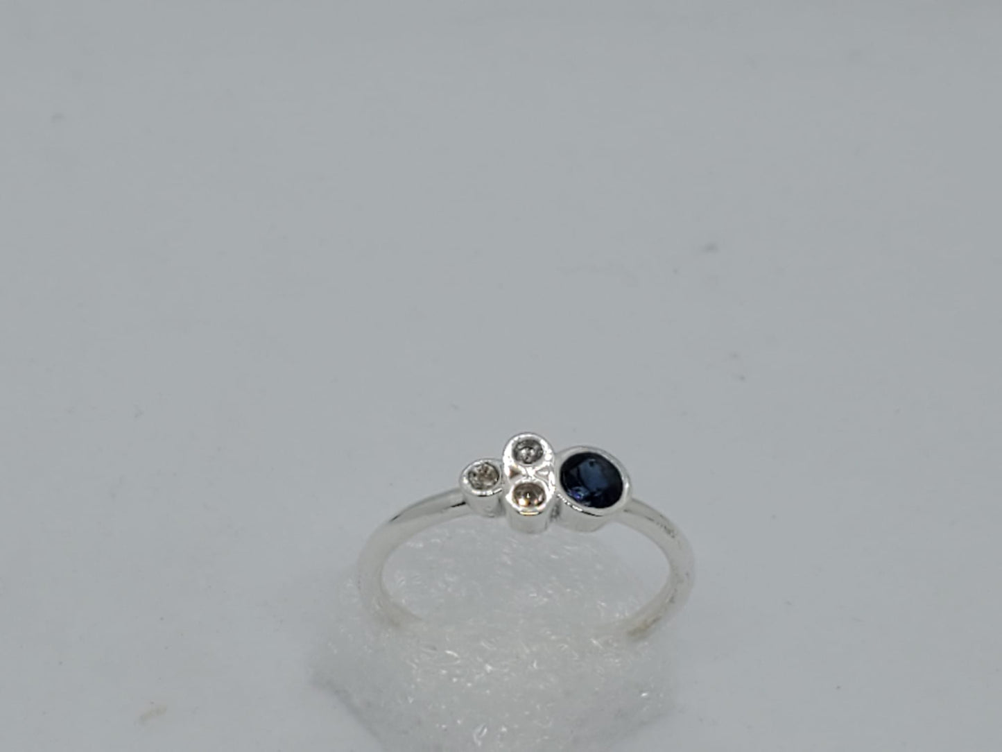 14k white gold ring, it has 3 Diamonds and 1 Natural Sapphire, for daily use and comfortable