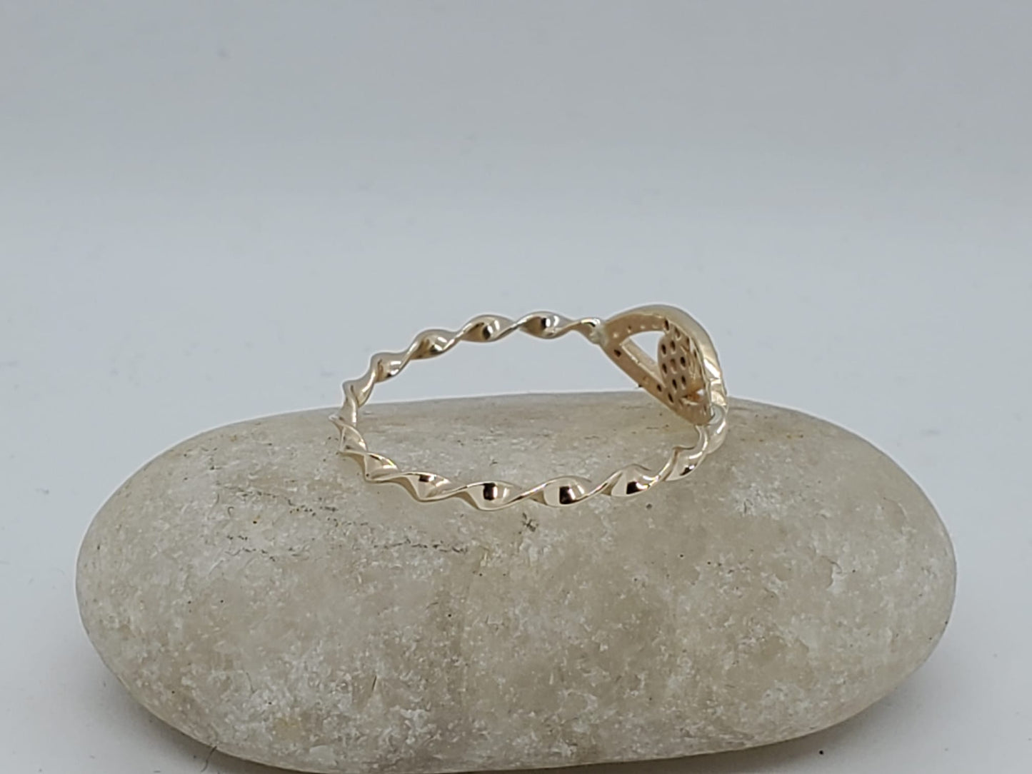 14k twist style yellow band ring with a lucky eye design, 1 Diamond 1.5mm