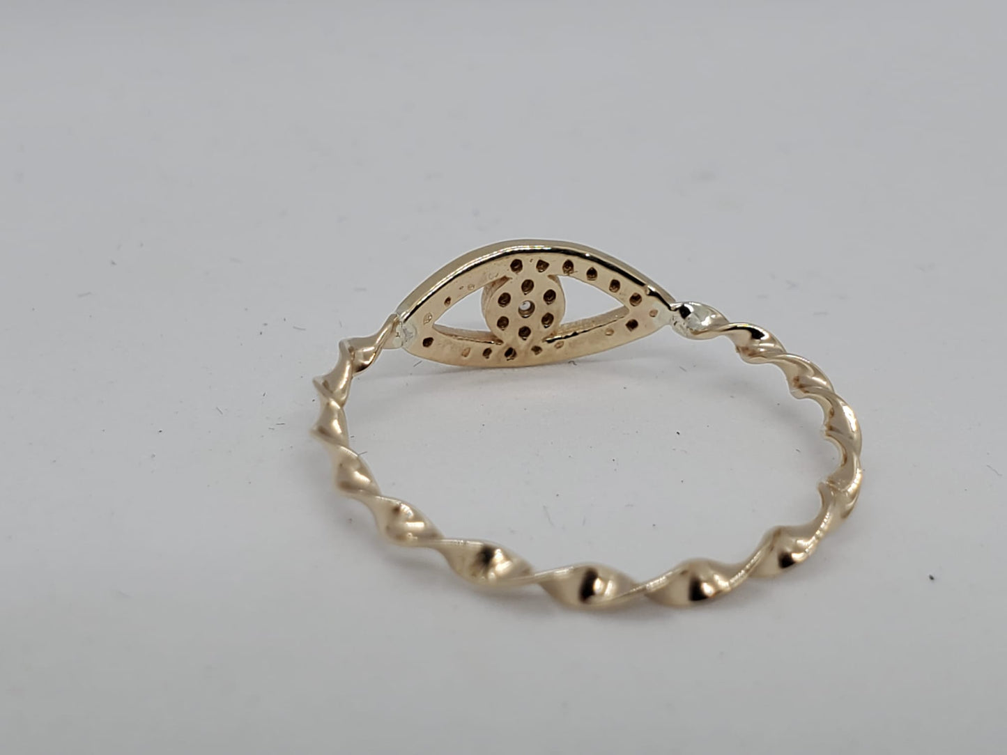 14k twist style yellow band ring with a lucky eye design, 1 Diamond 1.5mm